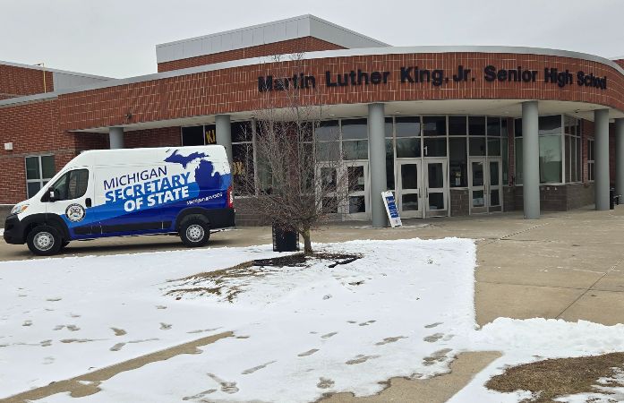  SOS Mobile Unit Van parked outside of MLK High School